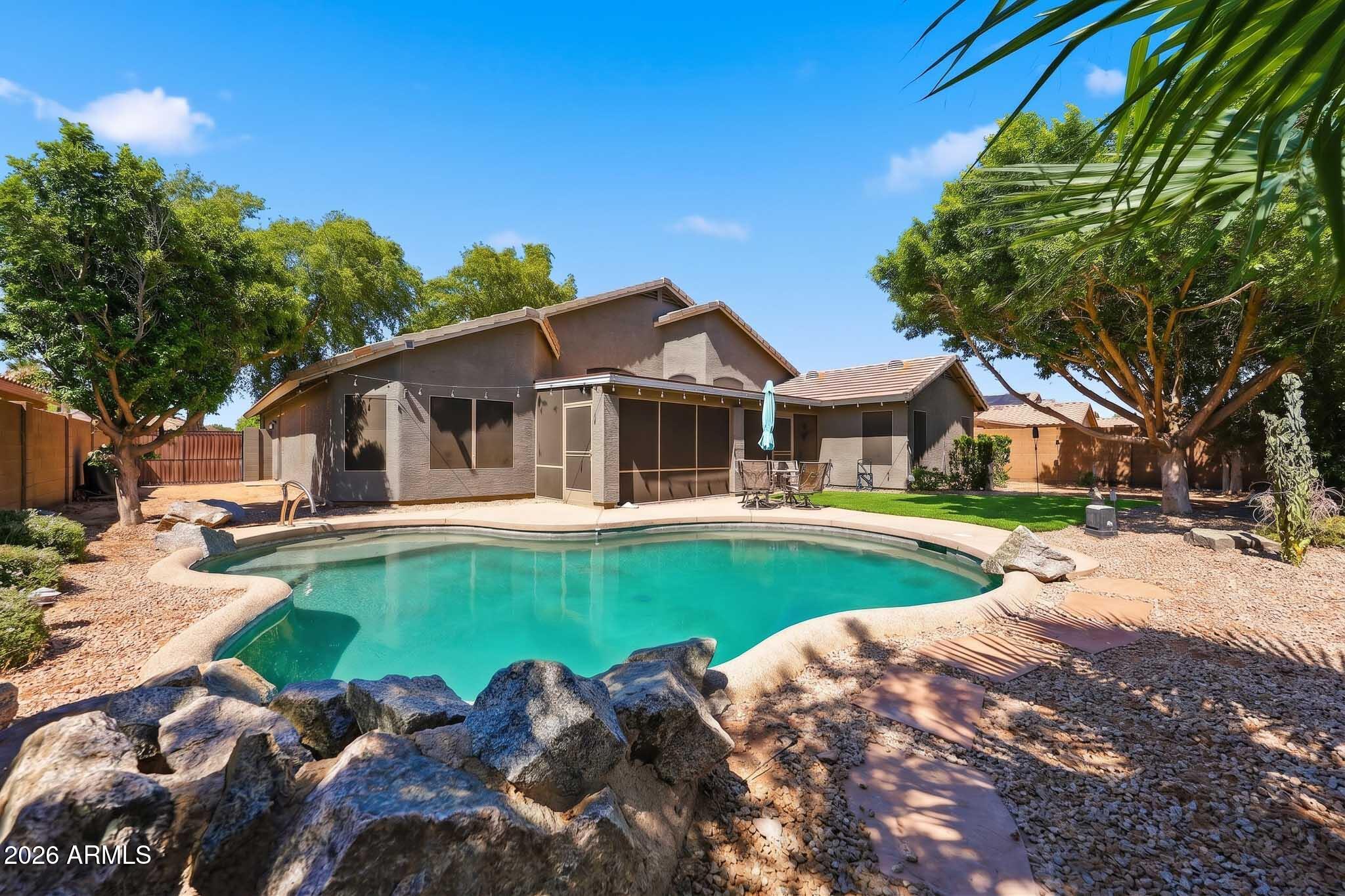 2153 East Kempton Road Chandler, AZ 85225 - Photo 47 of 50 a front view of a house with swimming pool