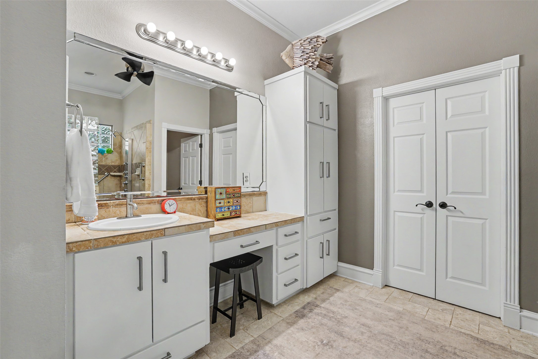 805 Boquilla Trail Georgetown, TX 78633 - Photo 24 of 40 a large bathroom with a double vanity sink a mirror and a bathtub