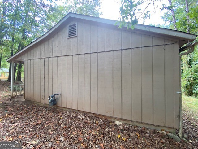 5389 Martins Crossing Road Stone Mountain, GA 30088 - Photo 28 of 30 a backyard of a house with lots of green space
