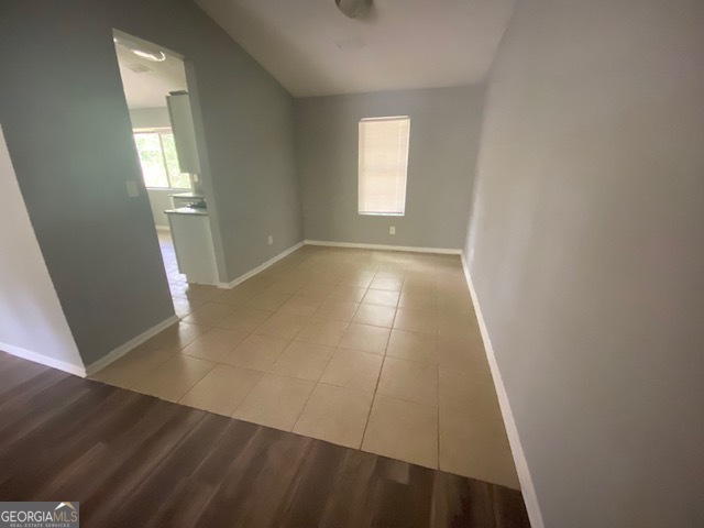 5389 Martins Crossing Road Stone Mountain, GA 30088 - Photo 6 of 30 an empty room with wooden floor and windows