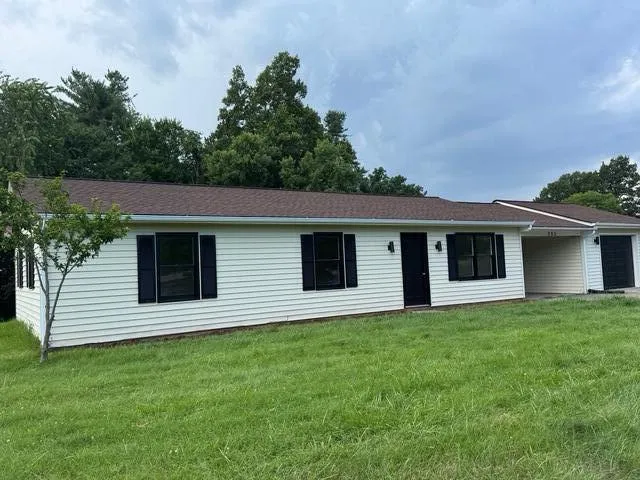 a view of a house with a yard