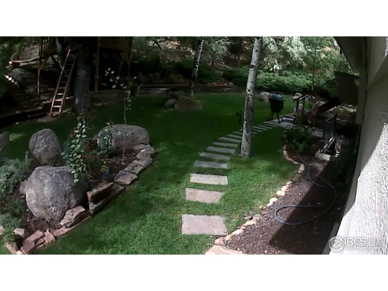 65 Arrowleaf Court Boulder, CO 80304 - Photo 30 of 38 Landscaped yard with treehouse