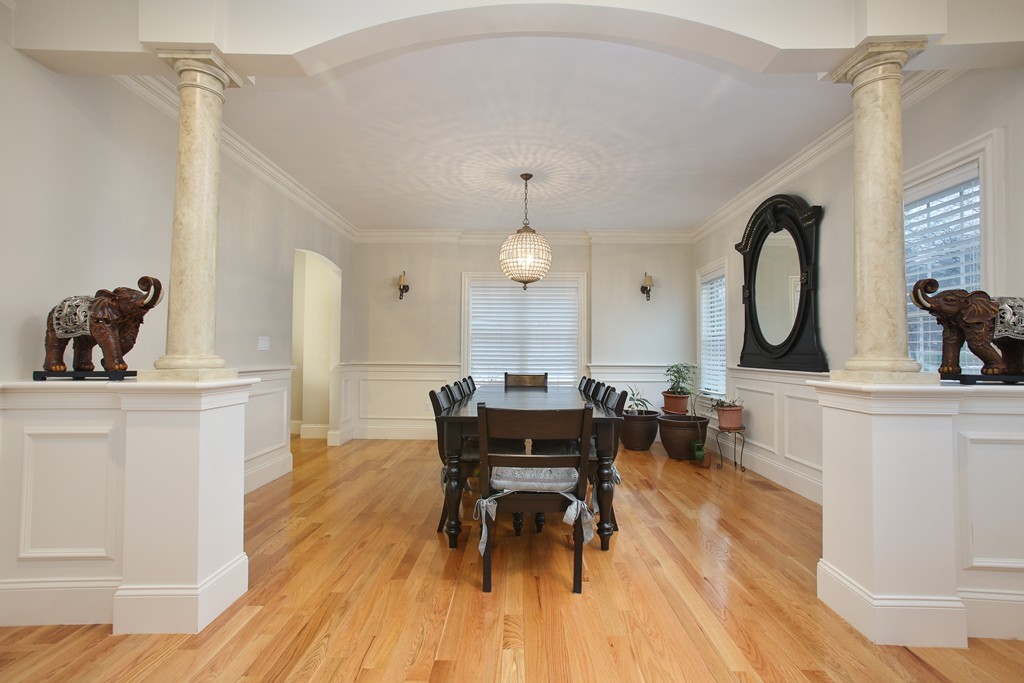 100 Drumlin Road Newton, MA 02459 - Photo 3 of 24 a view of a dining room with furniture and wooden floor