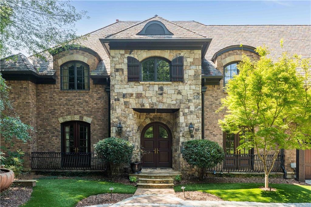 3558 Mill Creek Road Northeast Atlanta, GA 30319 - Photo 2 of 88 a front view of a house with garden