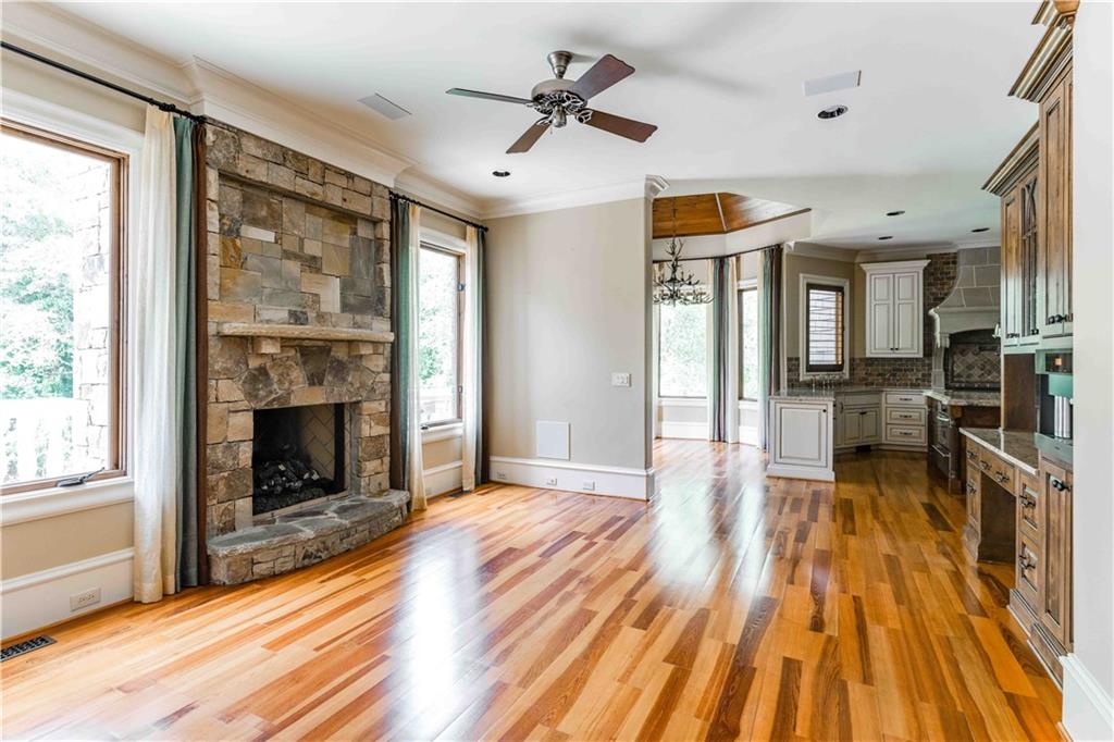 3558 Mill Creek Road Northeast Atlanta, GA 30319 - Photo 22 of 88 a view of a living room with wooden floor and a fireplace