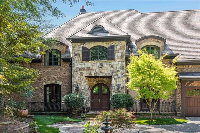 a front view of a house with garden