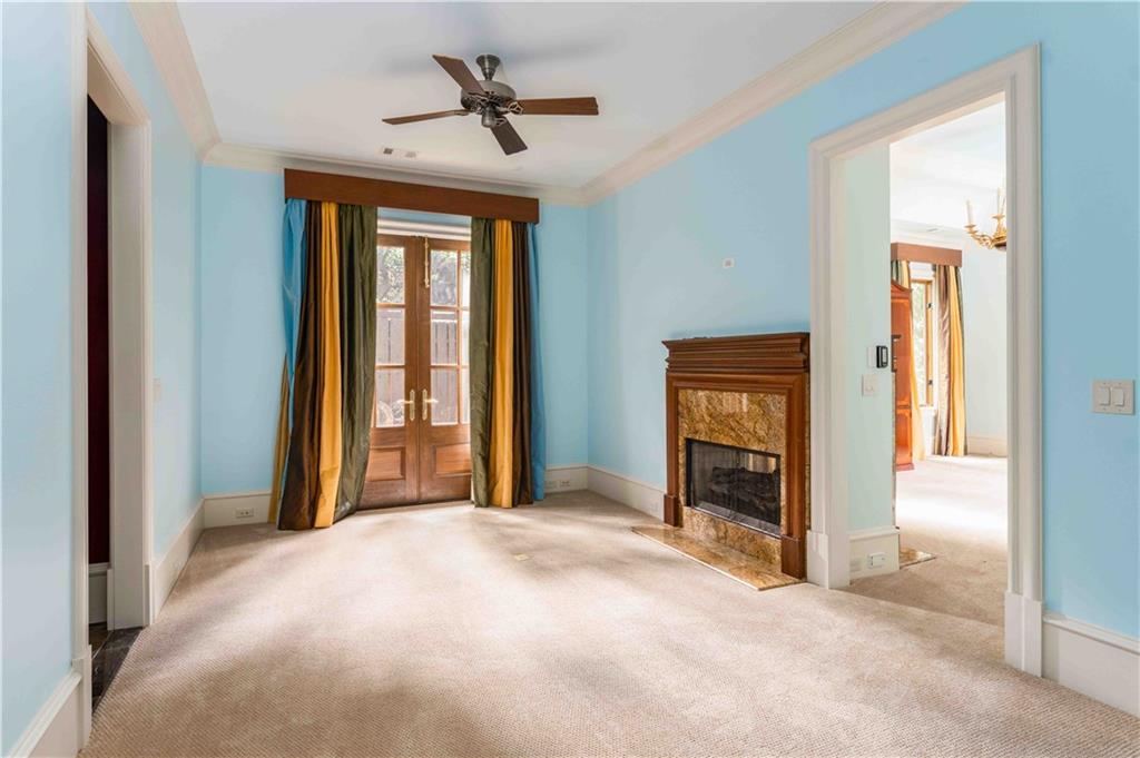 3558 Mill Creek Road Northeast Atlanta, GA 30319 - Photo 31 of 88 a view of a livingroom with a chandelier fan and windows