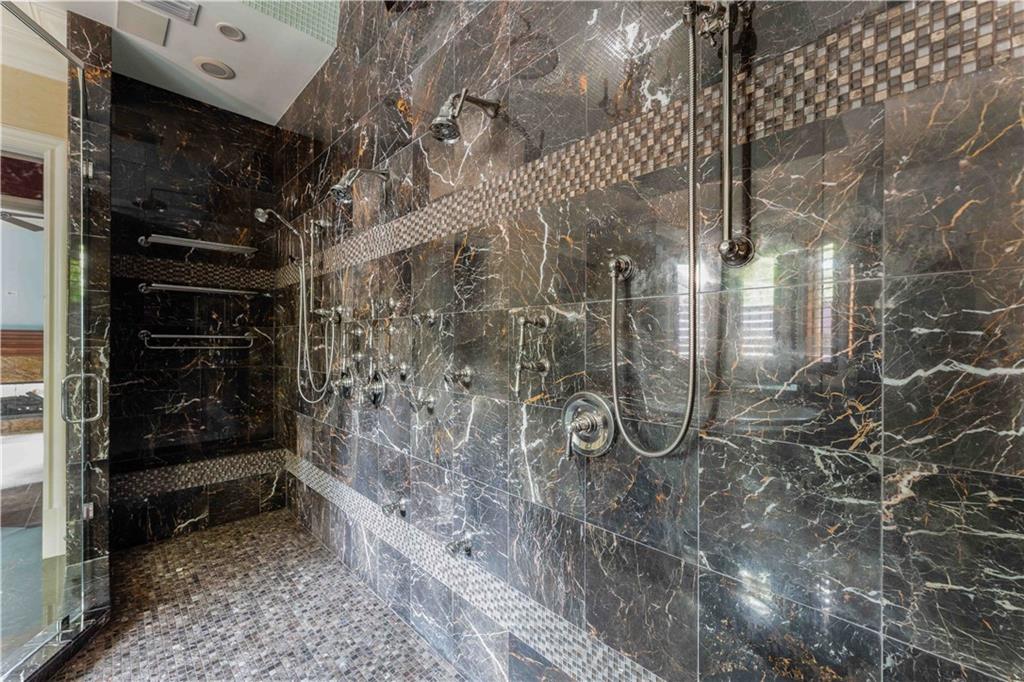 3558 Mill Creek Road Northeast Atlanta, GA 30319 - Photo 39 of 88 a bathroom with a glass shower door