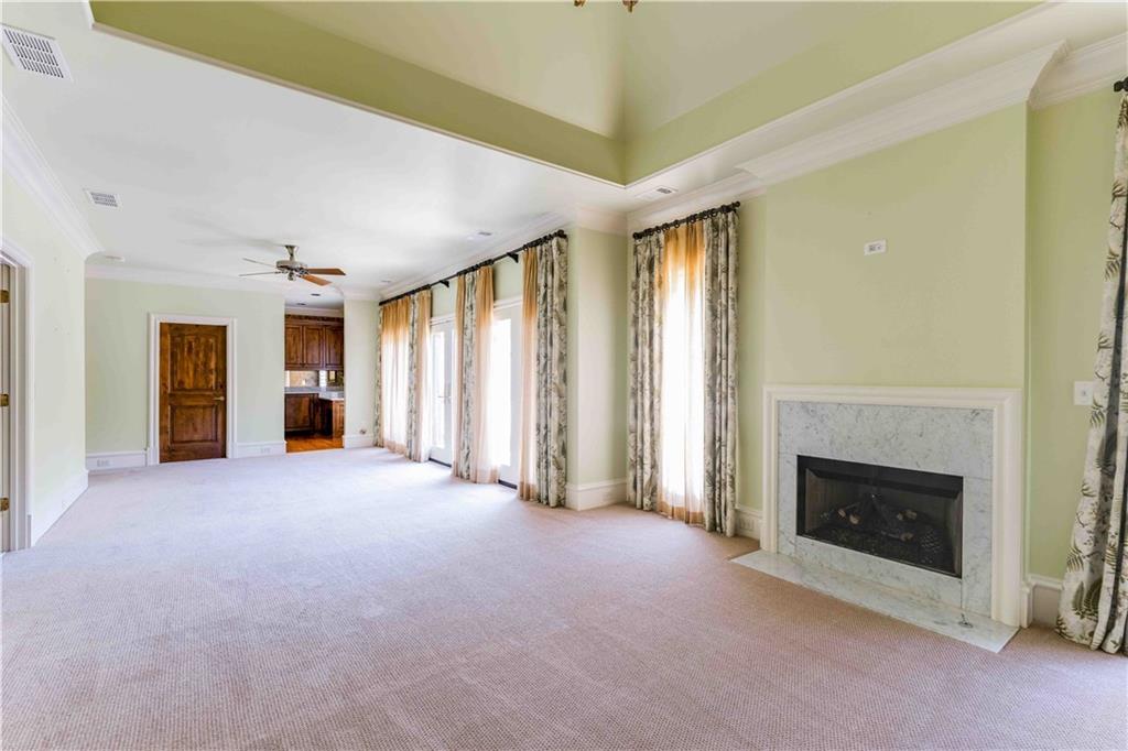 3558 Mill Creek Road Northeast Atlanta, GA 30319 - Photo 45 of 88 an empty room with windows and fireplace