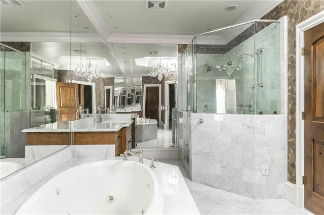 an aerial view of a house with a yard and outdoor seating