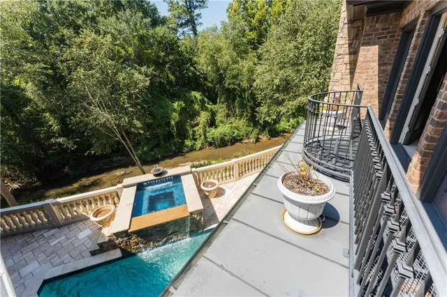 a view of a house with a yard and sitting area