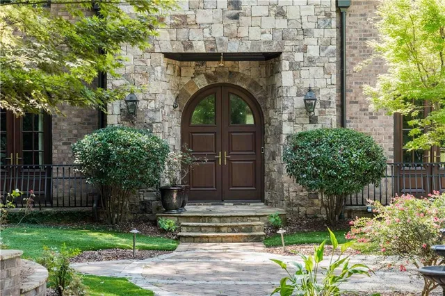 a view of a entryway door with a rug