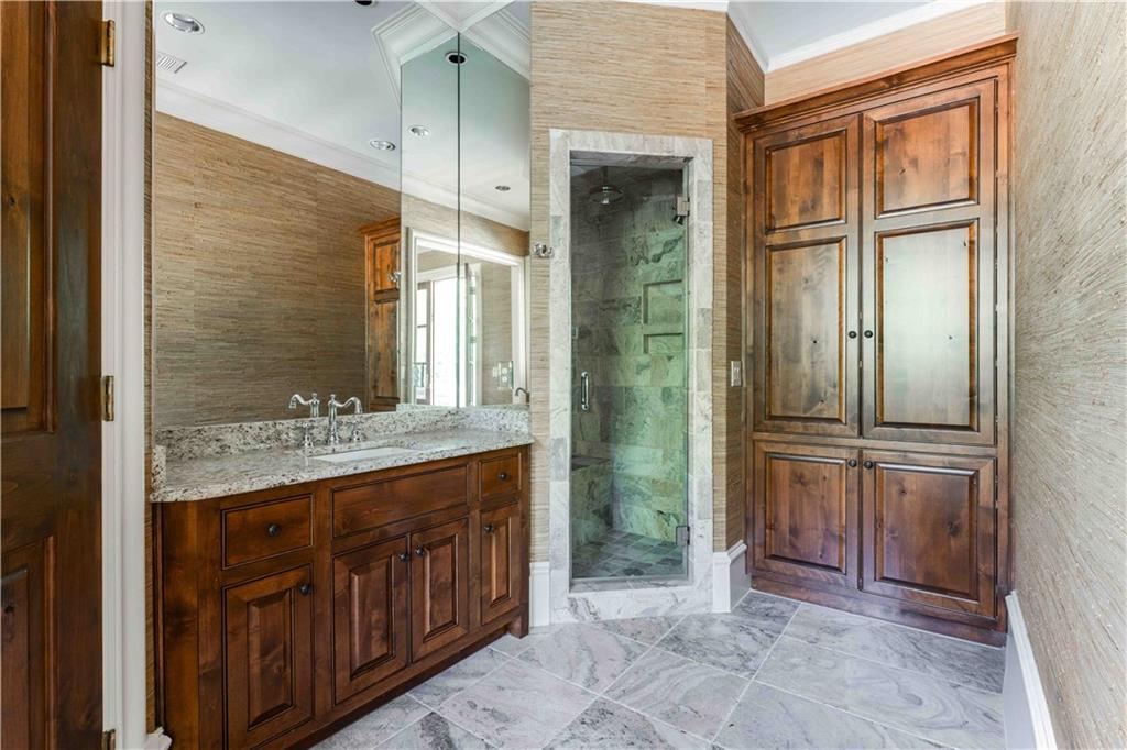 3558 Mill Creek Road Northeast Atlanta, GA 30319 - Photo 62 of 88 a bathroom with a granite countertop sink and a mirror