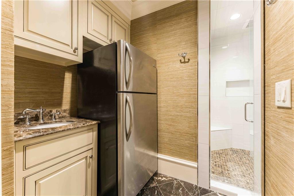 3558 Mill Creek Road Northeast Atlanta, GA 30319 - Photo 67 of 88 a kitchen with a refrigerator and a sink