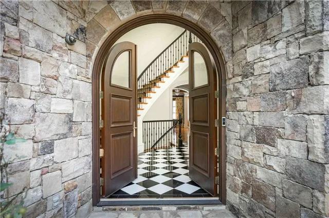a living room with a fireplace and a wooden floor