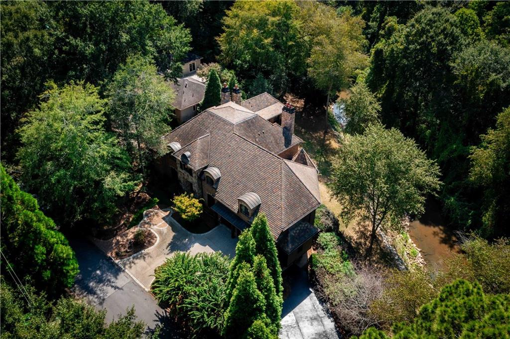 3558 Mill Creek Road Northeast Atlanta, GA 30319 - Photo 84 of 88 an aerial view of a house with a yard and outdoor seating
