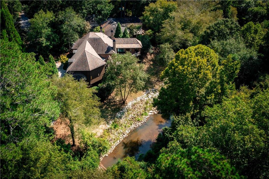 3558 Mill Creek Road Northeast Atlanta, GA 30319 - Photo 87 of 88 a view of a house with a yard and sitting area
