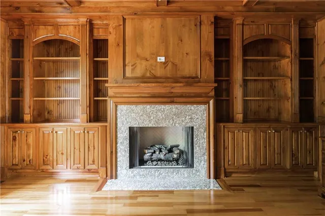 a vase of flowers sitting on a table with a potted plant