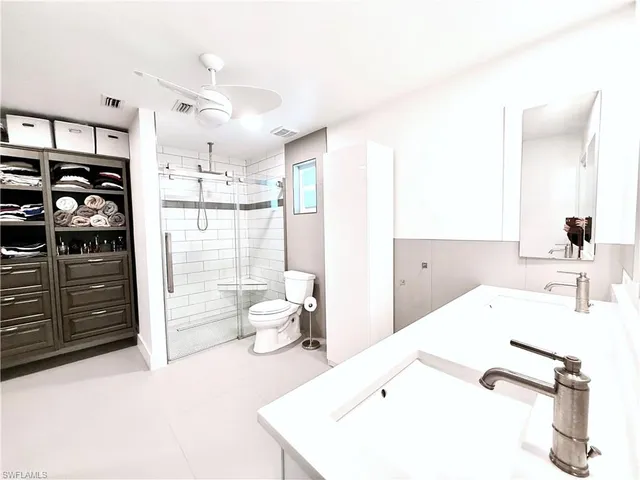 a living room with hard wood flooring and a couch