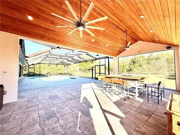 a view of a swimming pool with a patio
