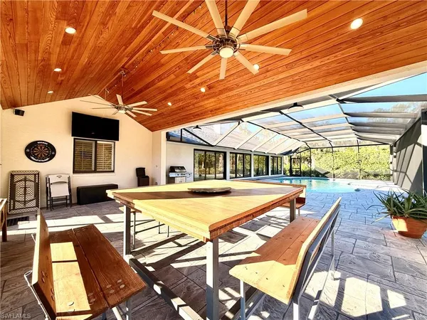 a house with swimming pool in front of it