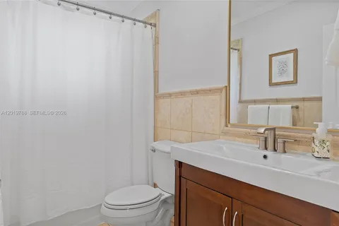 a bathroom with a sink toilet and vanity