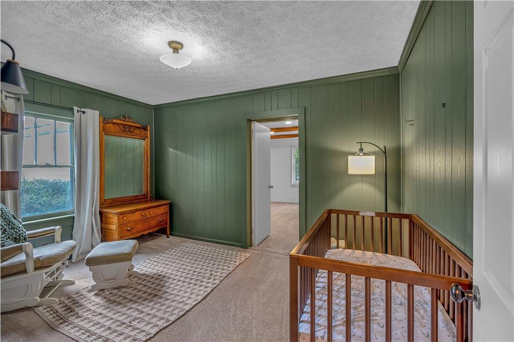 210 McCanless Street Cartersville, GA 30120 - Photo 13 of 27 a bedroom with furniture and a window