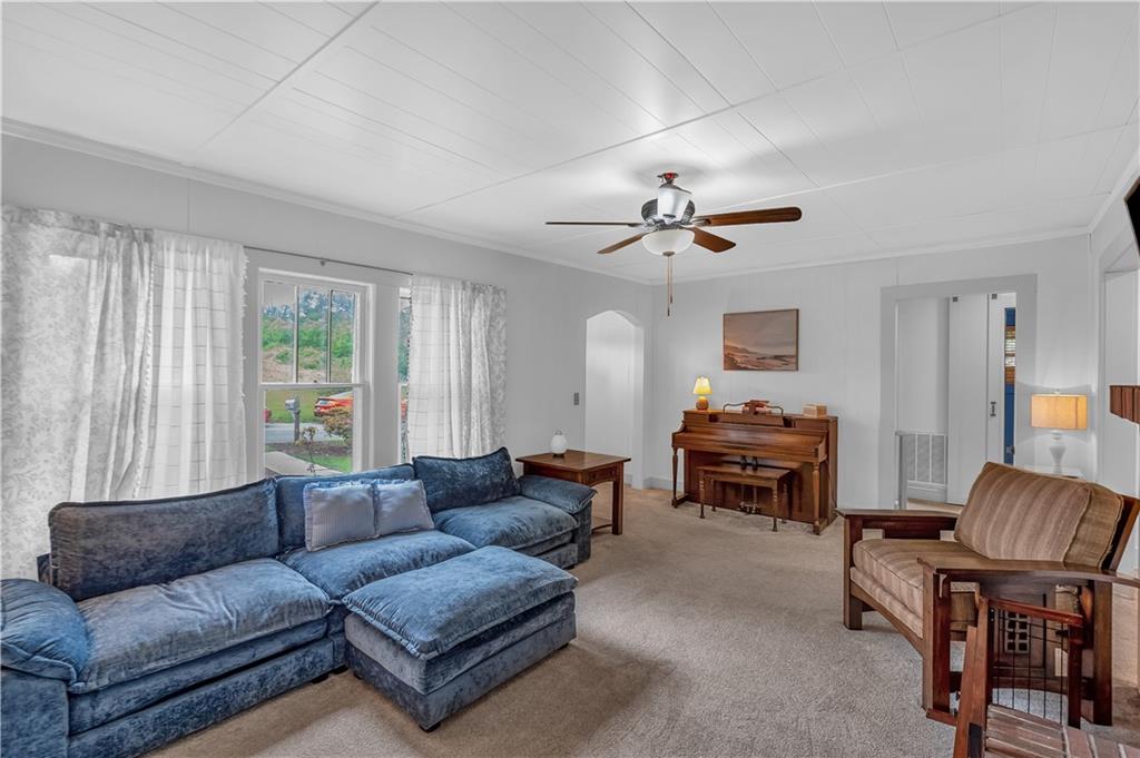 210 McCanless Street Cartersville, GA 30120 - Photo 6 of 27 a living room with furniture a ceiling fan and a window