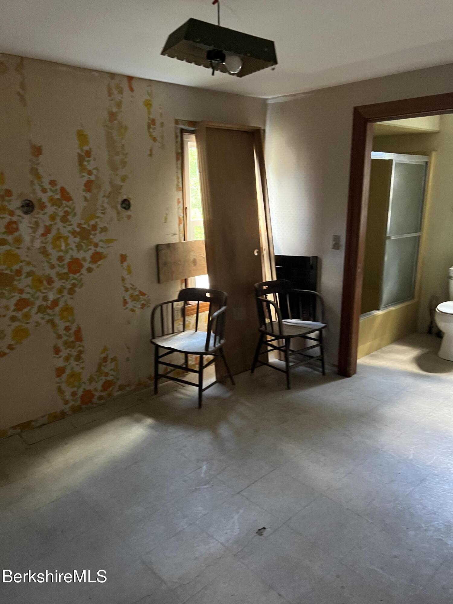 111 Columbia Street Adams, MA 01220 - Photo 13 of 21 a view of a livingroom with furniture and a window