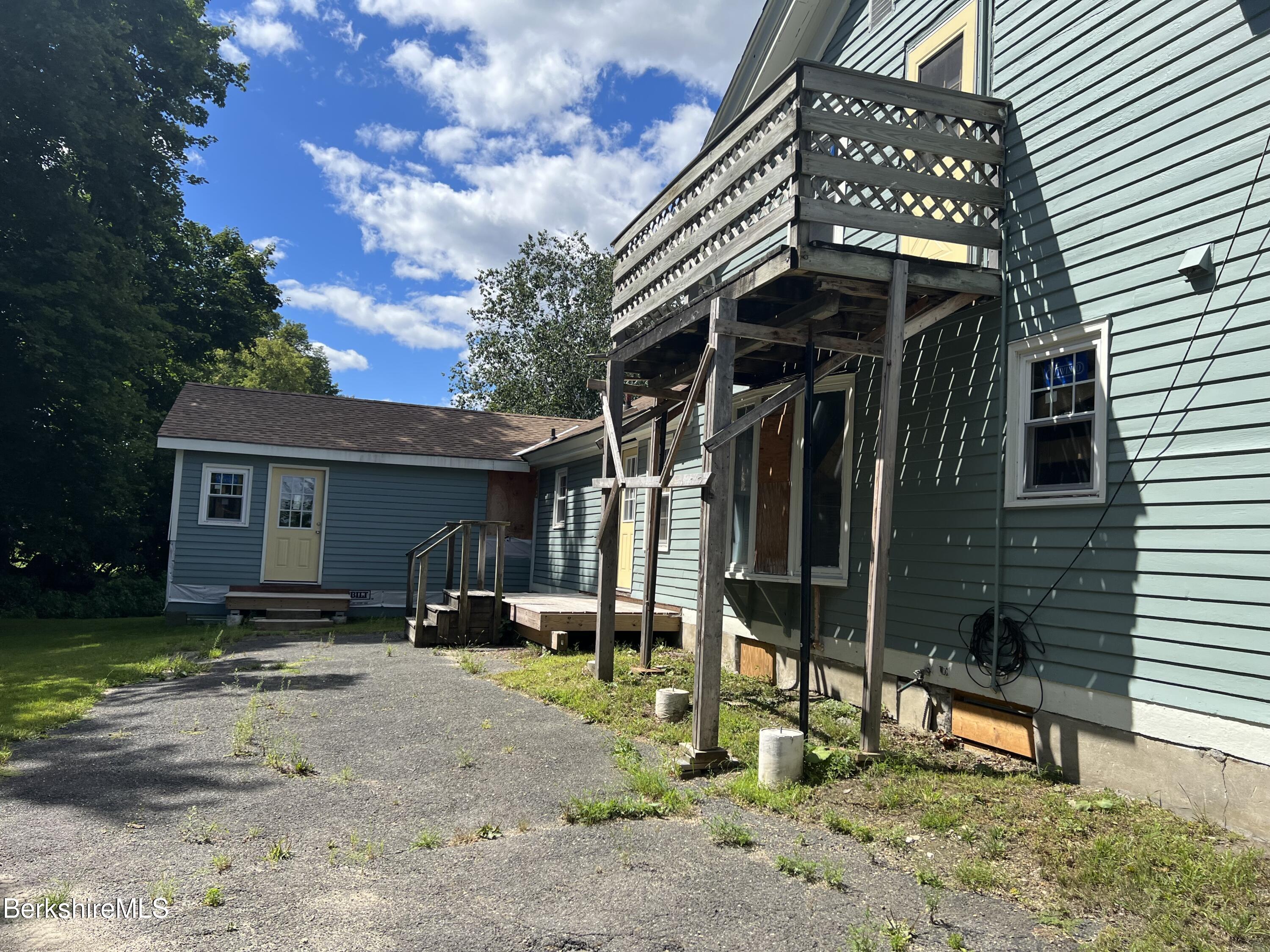 111 Columbia Street Adams, MA 01220 - Photo 5 of 21 a view of a house with a yard and furniture