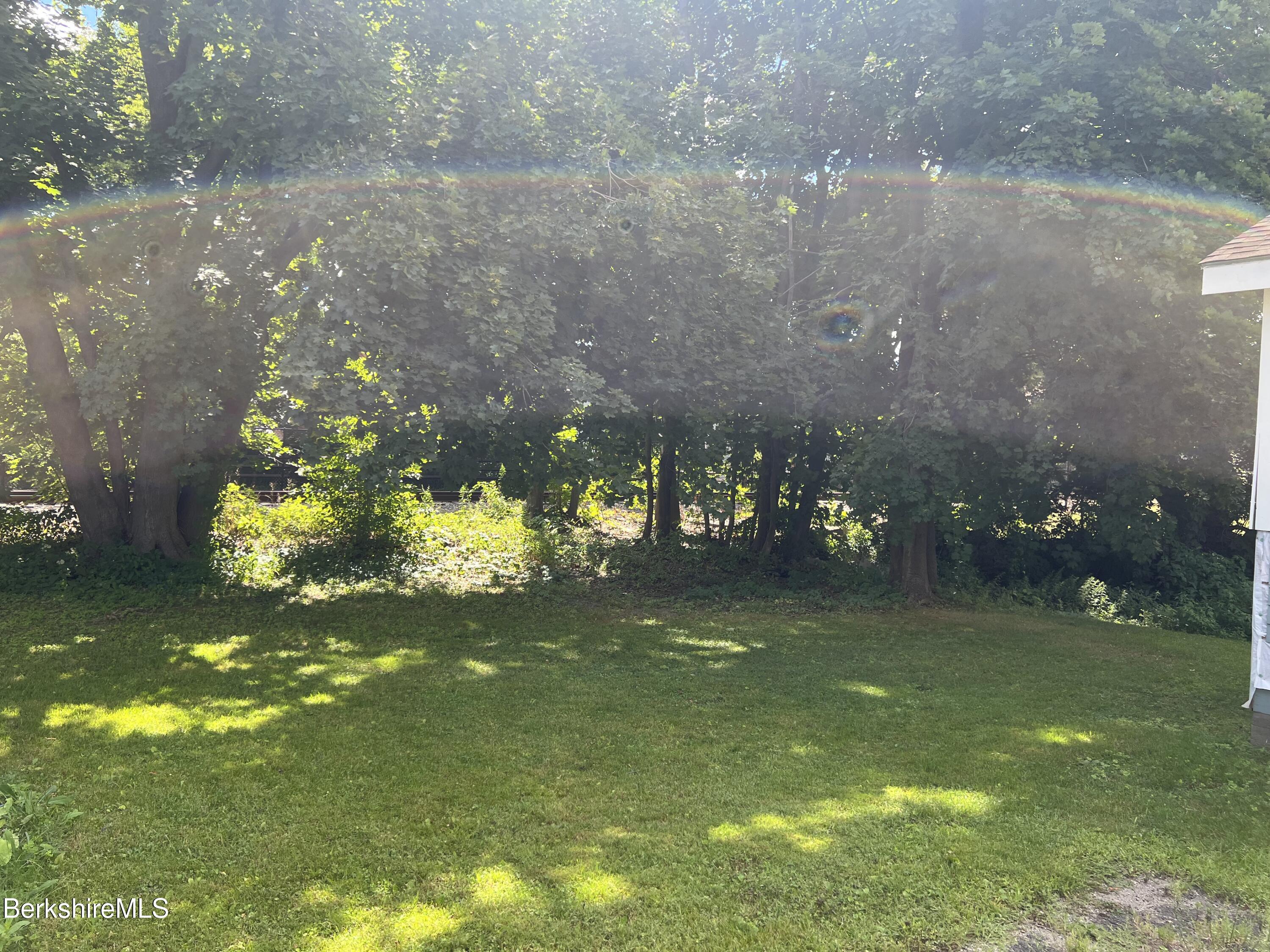 111 Columbia Street Adams, MA 01220 - Photo 6 of 21 a view of a green yard