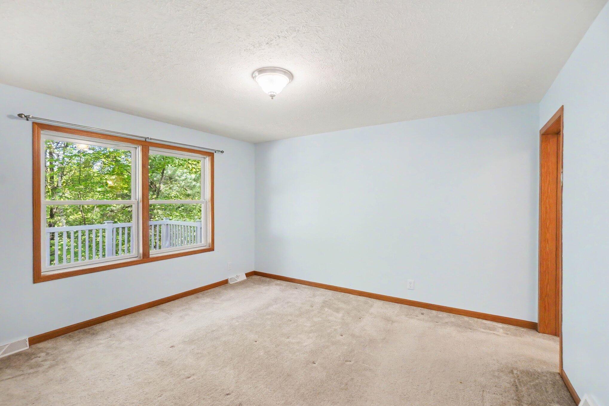 6360 West 8 Mile Road Irons, MI 49644 - Photo 7 of 25 Primary Bedroom