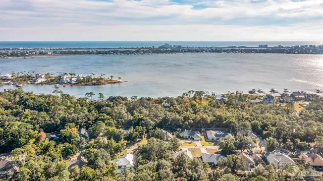 a view of a room with wooden floor and bench