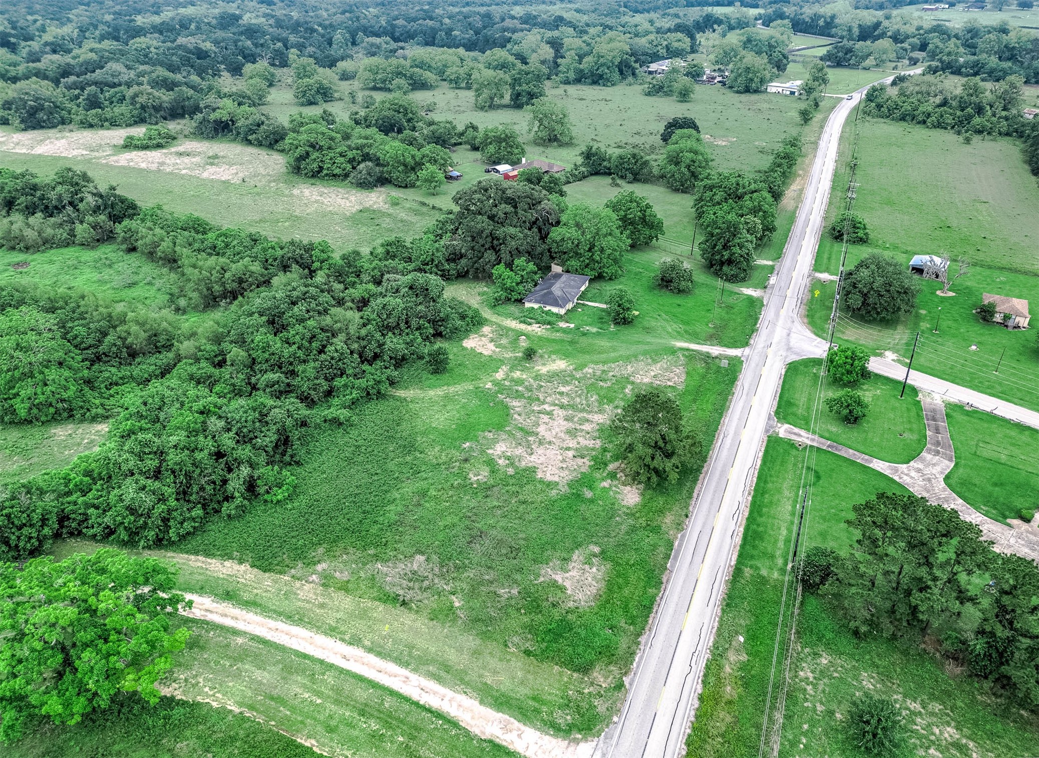 0 FM 524 Road Sweeny, TX 77480 - Photo 4 of 5 a view of a green yard with large trees