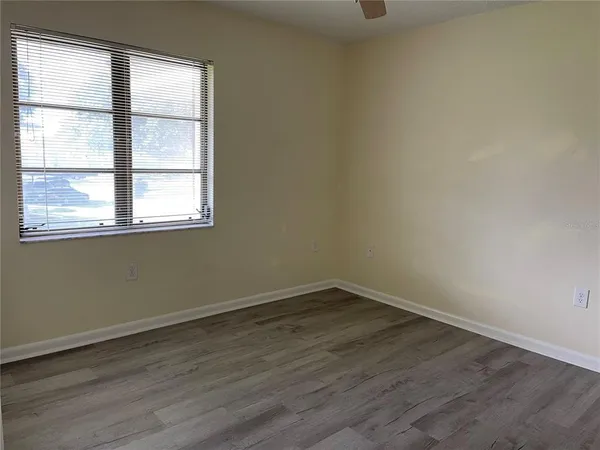 a bathroom with a toilet and a bath tub