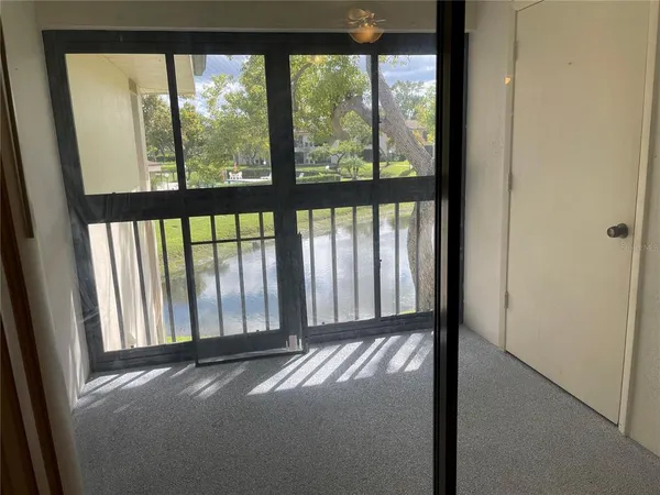 a view of a house with swimming pool and sitting area