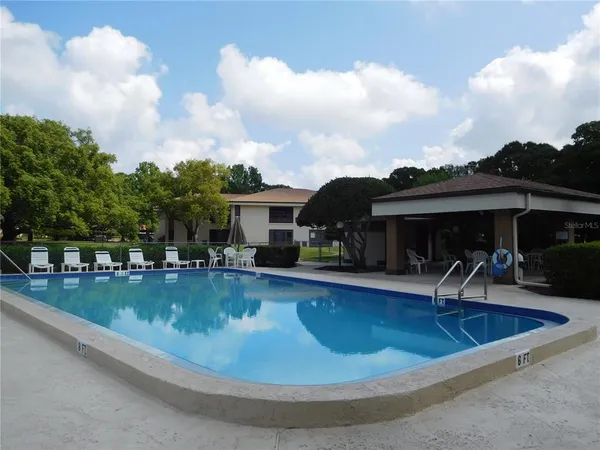 an outdoor view of the house and car parked