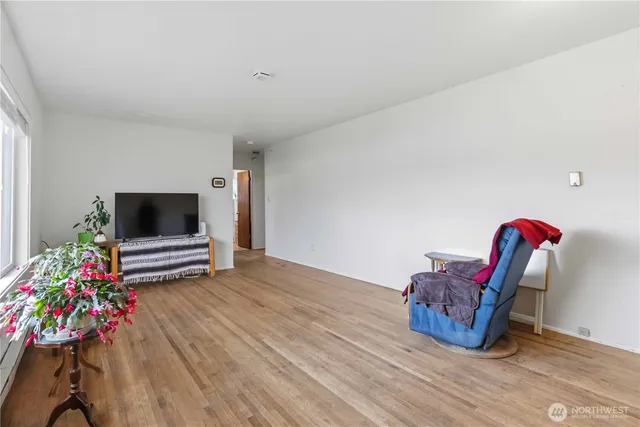 a living room with furniture and flowers