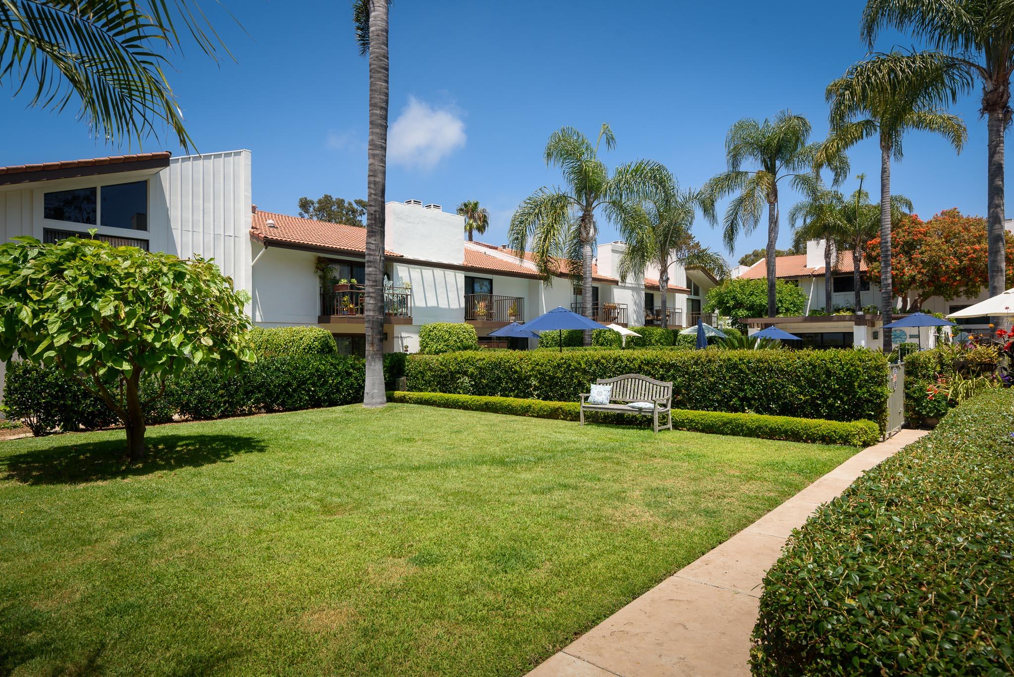 671 Del Parque Drive Santa Barbara, CA 93103 - Photo 12 of 18 a view of a house with a yard and potted plants