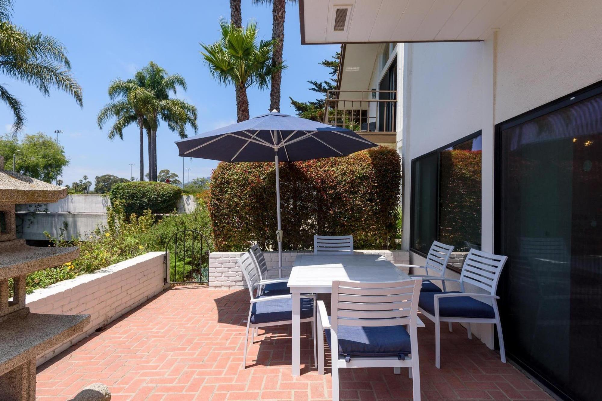 671 Del Parque Drive Santa Barbara, CA 93103 - Photo 5 of 18 a view of a patio with furniture and a yard