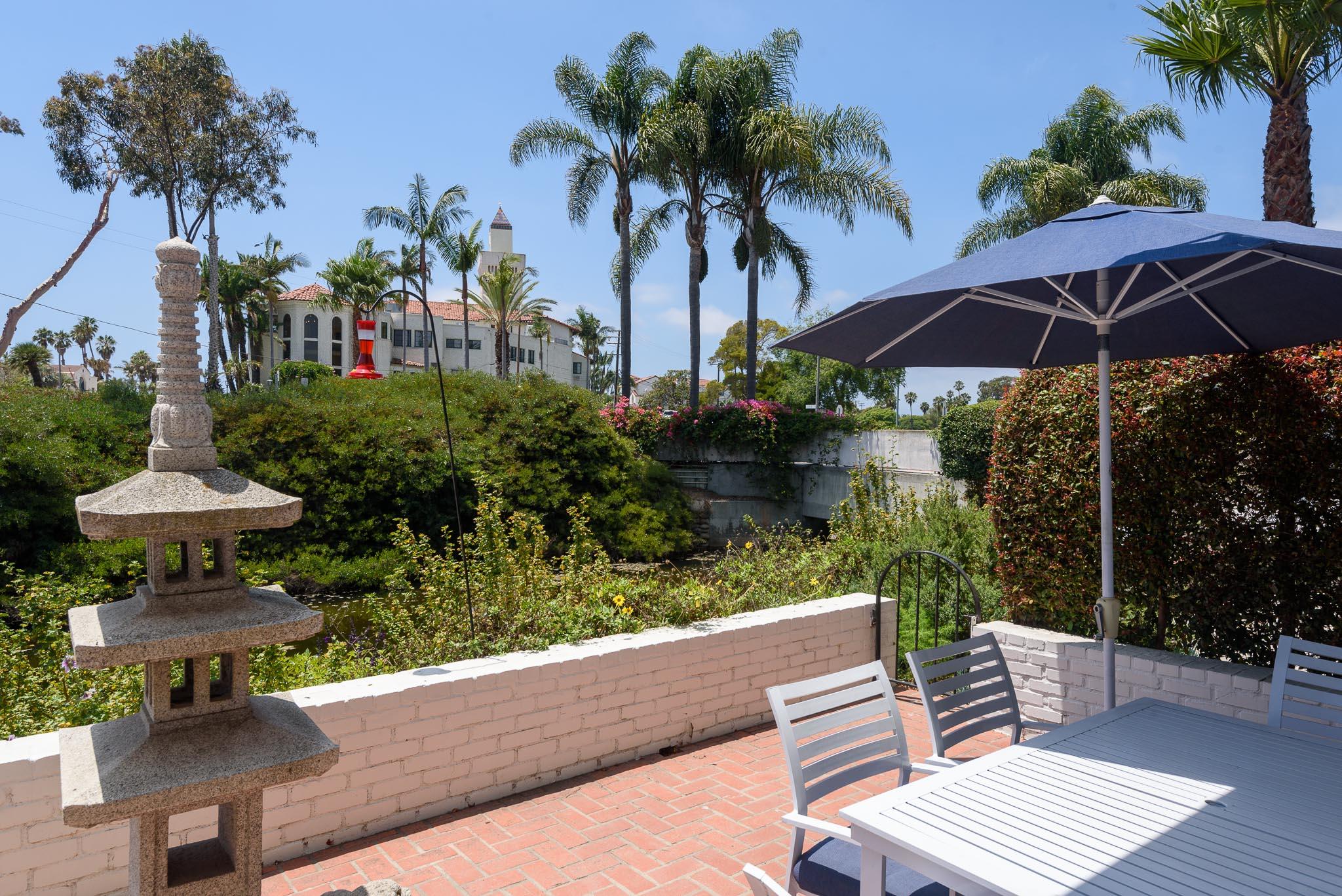 671 Del Parque Drive Santa Barbara, CA 93103 - Photo 6 of 18 a view of table and chairs under an umbrella