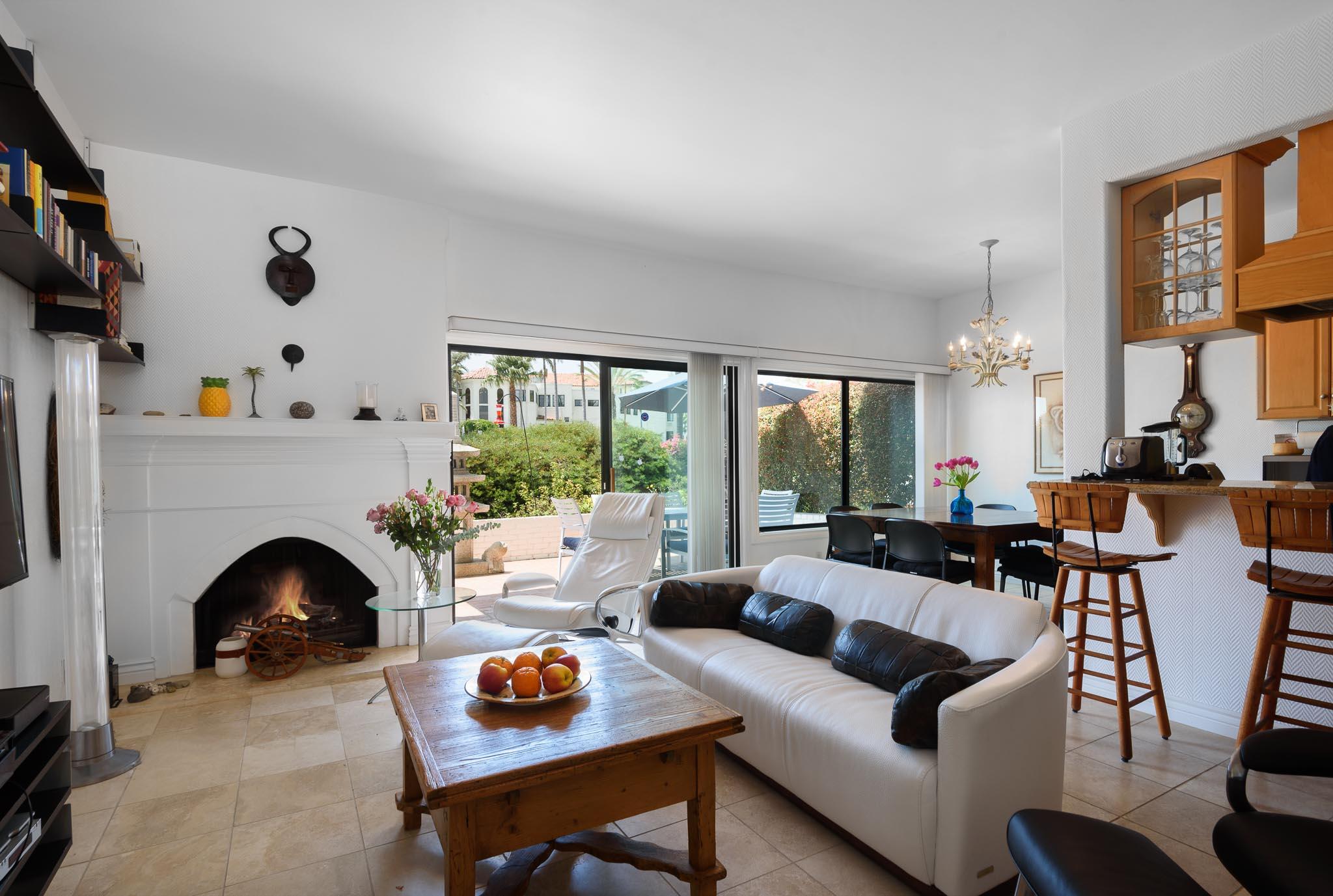 671 Del Parque Drive Santa Barbara, CA 93103 - Photo 8 of 18 a living room with furniture fireplace and a large window