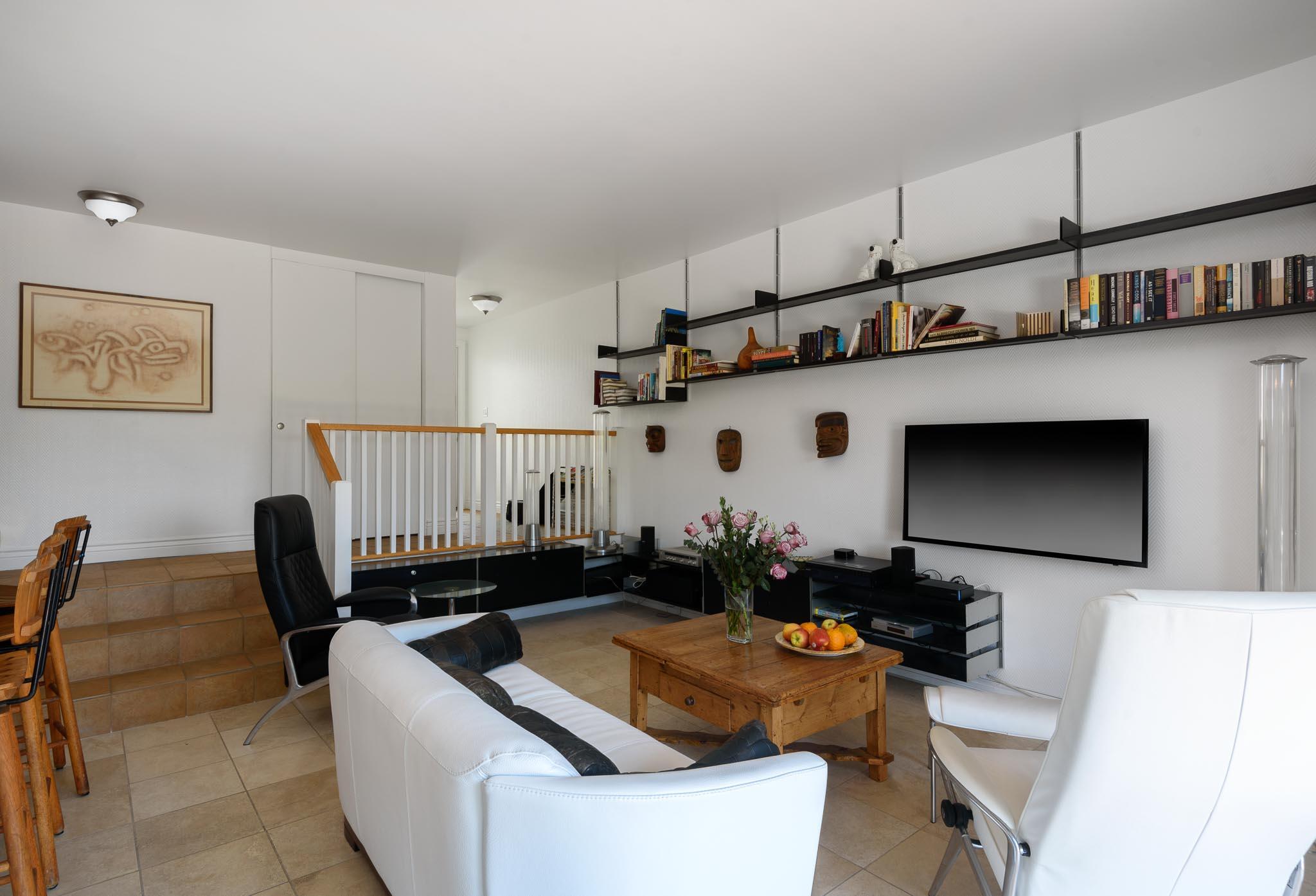 671 Del Parque Drive Santa Barbara, CA 93103 - Photo 9 of 18 a living room with furniture a flat screen tv and a dining table