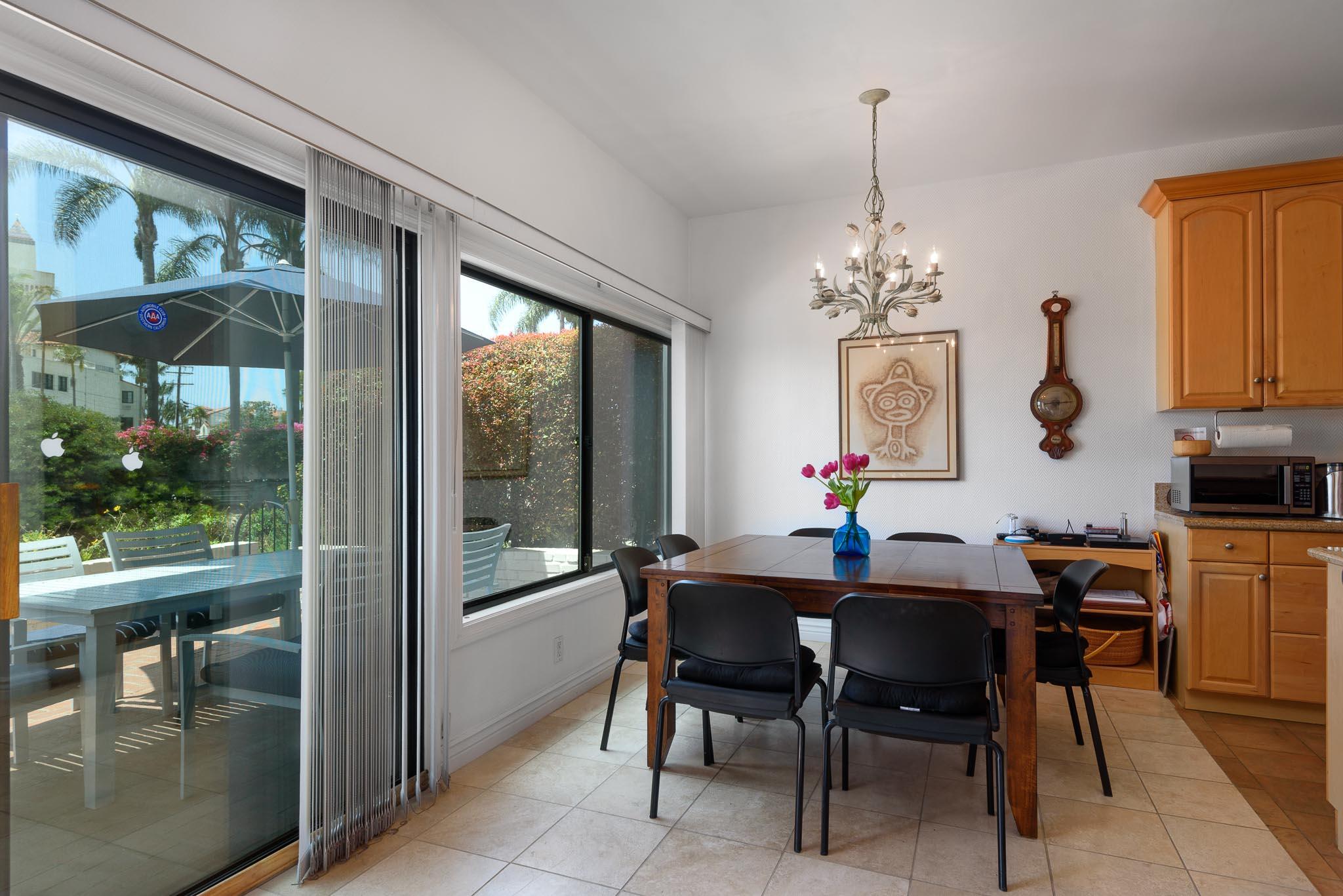 671 Del Parque Drive Santa Barbara, CA 93103 - Photo 10 of 18 a dining room with furniture a chandelier and window