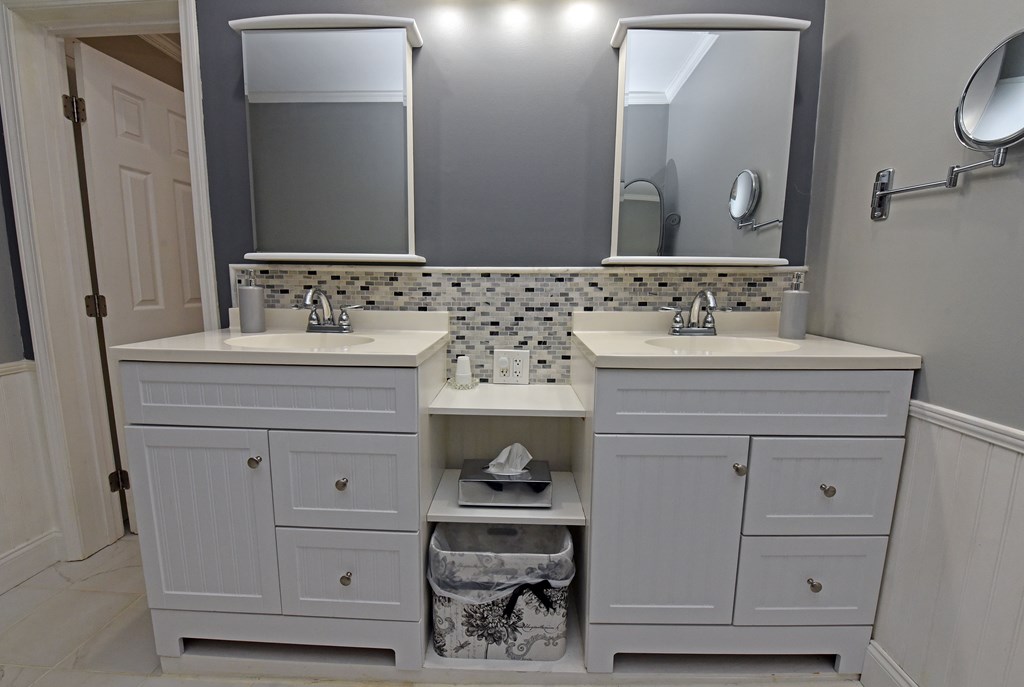 63 Loving Road Morganton, GA 30560 - Photo 50 of 58 a bathroom with a sink vanity and a mirror