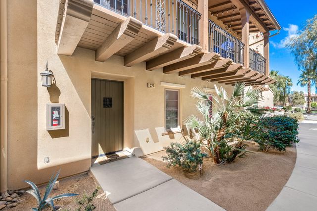 a view of a house with a flower garden