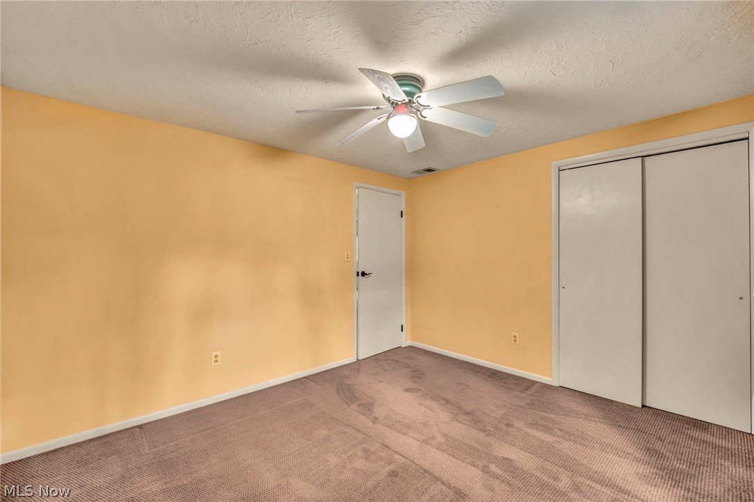 6845 Liberty Road Solon, OH 44139 - Photo 37 of 47 Bedroom featuring textured carpeting and light yellow wall paint