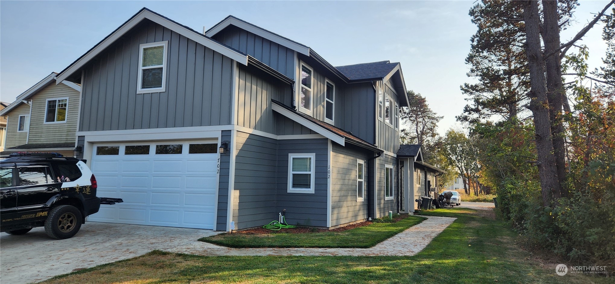 702 E Street Blaine, WA 98230 - Photo 1 of 4 a front view of a house with a yard