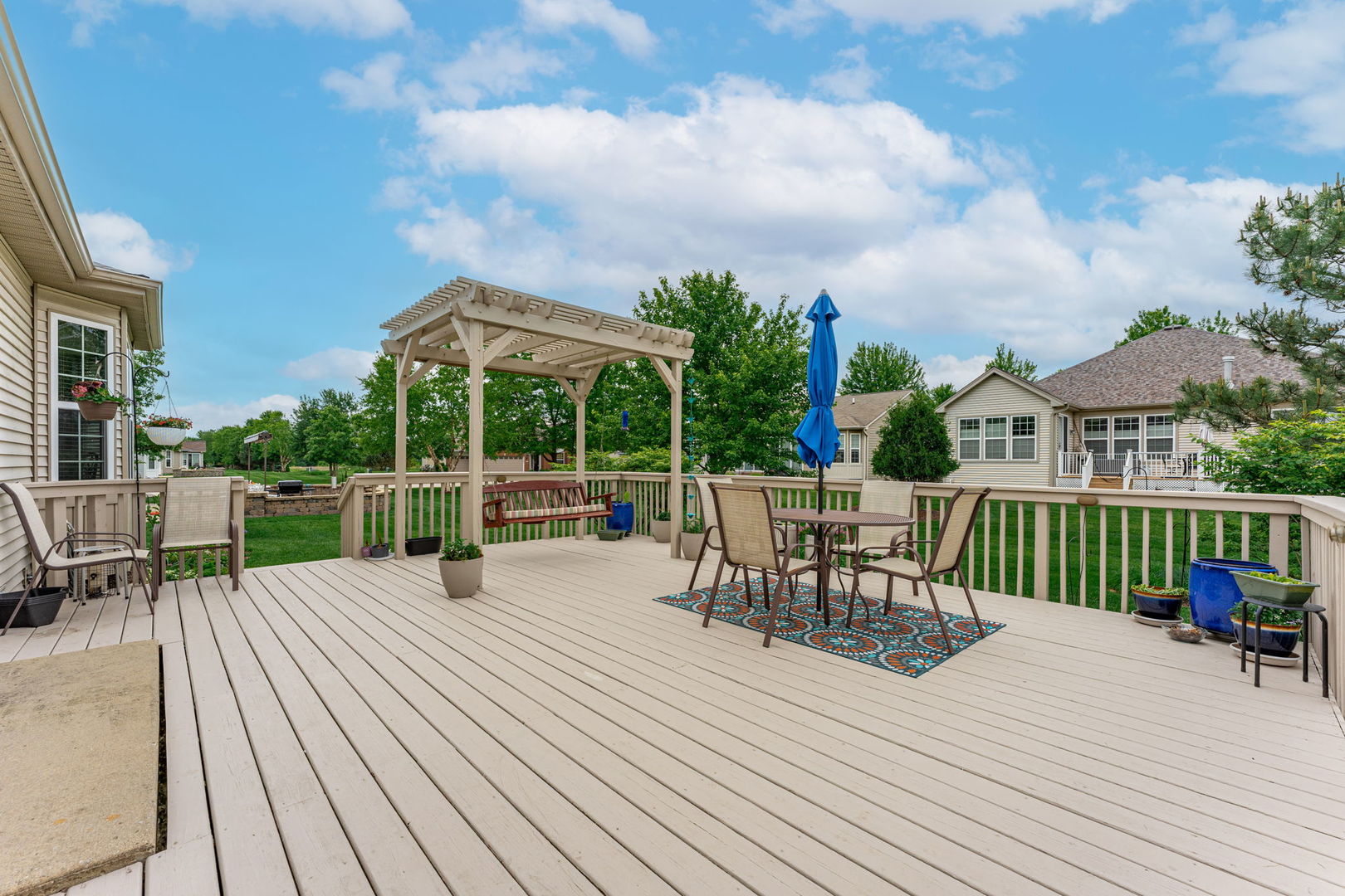 632 Tuscan View Drive Elgin, IL 60124 - Photo 45 of 52 a view of a patio with dining table and chairs with wooden floor
