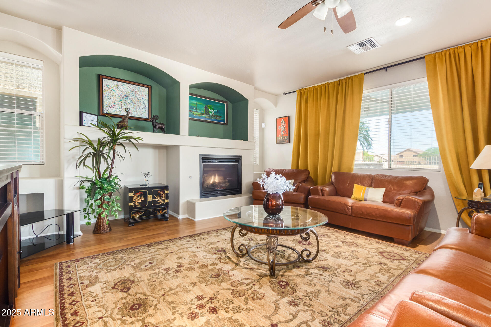 6635 South Cottonfields Lane Laveen, AZ 85339 - Photo 11 of 49 a living room with furniture and a fireplace
